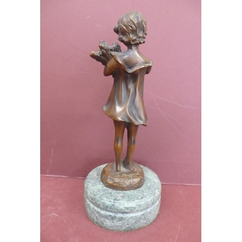 228 - S. Buzard? 20thC young girl holding firewood, brown patinated bronze on a green marble base signed, ... 