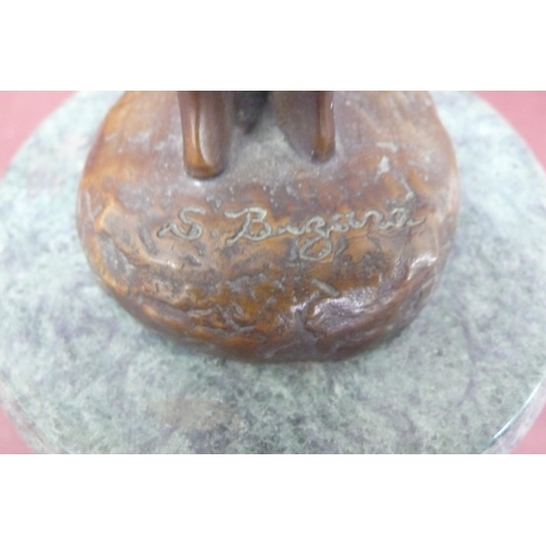 228 - S. Buzard? 20thC young girl holding firewood, brown patinated bronze on a green marble base signed, ... 