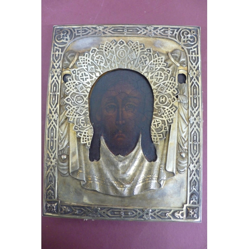 232 - 19thC Russian silver icon of the head of Christ with a silver halo held in an outer glazed case, gil... 