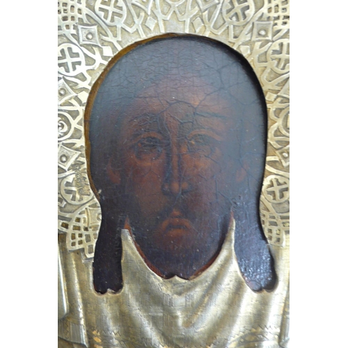 232 - 19thC Russian silver icon of the head of Christ with a silver halo held in an outer glazed case, gil... 