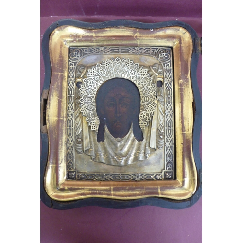 232 - 19thC Russian silver icon of the head of Christ with a silver halo held in an outer glazed case, gil... 