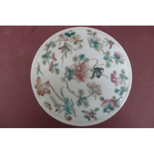 233 - 19thC Chinese porcelain two section circular box with cover having decoration of flowers and insects... 