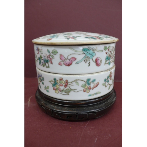 233 - 19thC Chinese porcelain two section circular box with cover having decoration of flowers and insects... 