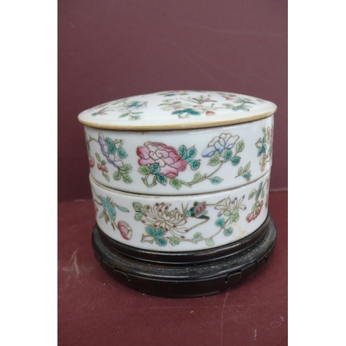 233 - 19thC Chinese porcelain two section circular box with cover having decoration of flowers and insects... 