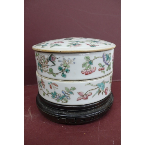 233 - 19thC Chinese porcelain two section circular box with cover having decoration of flowers and insects... 