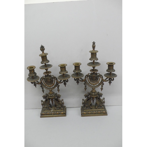 240 - Pair of late Victorian ornate brass three branch candelabra with flaming torch finial, decoration of... 