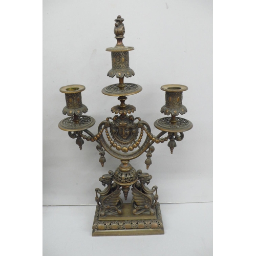 240 - Pair of late Victorian ornate brass three branch candelabra with flaming torch finial, decoration of... 