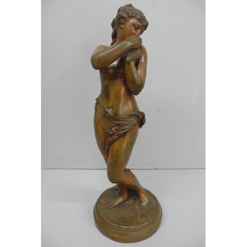 242 - R. Cajani, Nude woman holding a dover, brown patinated bronze - height 12.5ins