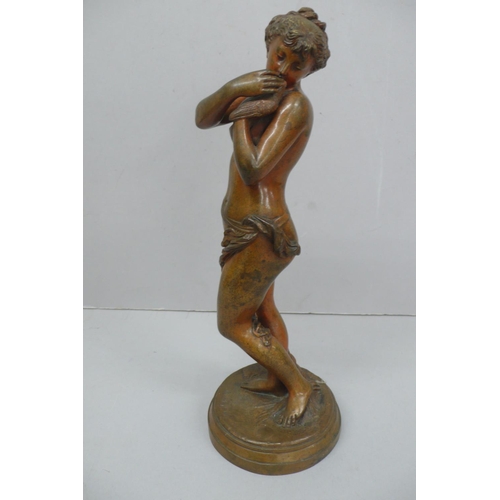 242 - R. Cajani, Nude woman holding a dover, brown patinated bronze - height 12.5ins