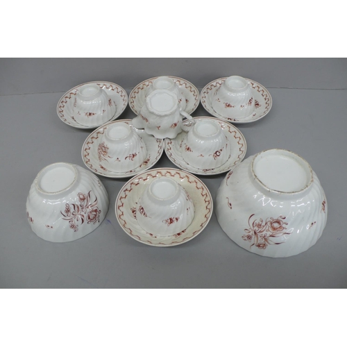 246 - A set of six 19thC continental tea bowls and saucers with rust coloured hand painted floral decorati... 