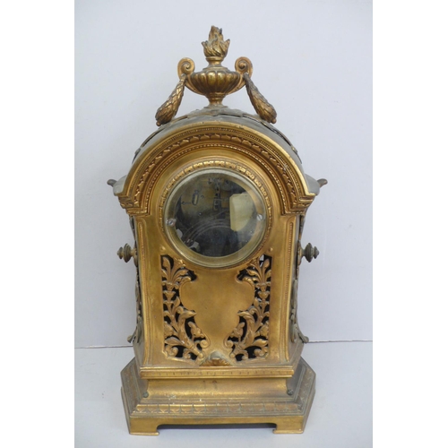 257 - 19thC French ormolu mantel clock with flaming urn finial to dome top, enamel numerals to brass dial,... 