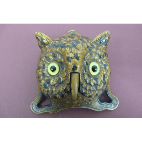 261 - 19th/20thC cold painted iron wind up shop counter bell in the form of an owl with yellow glass eyes,... 