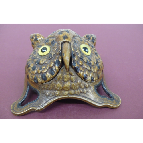 261 - 19th/20thC cold painted iron wind up shop counter bell in the form of an owl with yellow glass eyes,... 