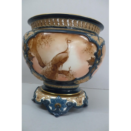 264 - Hadley's Worcester porcelain vase with pierced border peacock decoration to cartouches on four splay... 