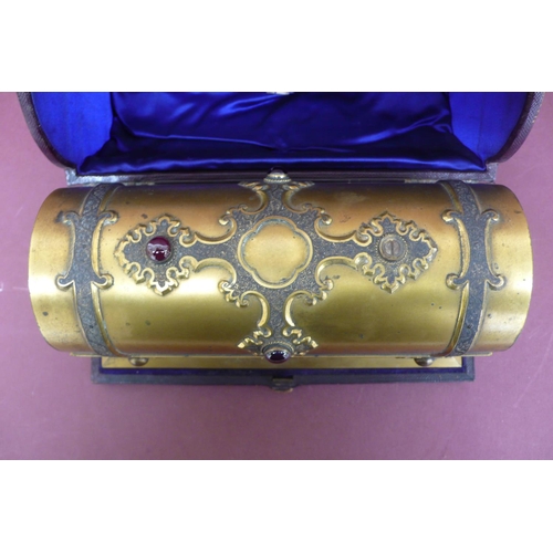 275 - A Victorian quality ormolu casket holding three hobnail cut clear glass bottles, the casket adorned ... 