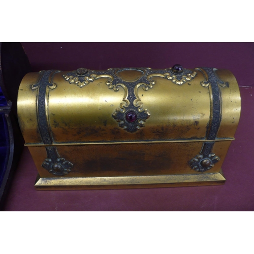 275 - A Victorian quality ormolu casket holding three hobnail cut clear glass bottles, the casket adorned ... 