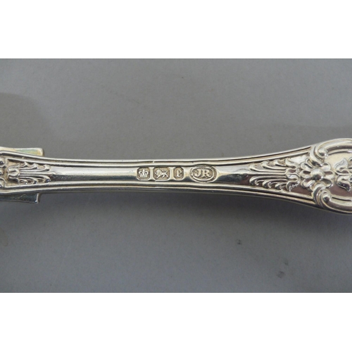 276 - A set of Victorian Silver, fiddle, thread and shell pattern flatware consisting of 12 pudding spoons... 