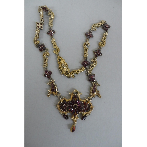 304 - Victorian style silver gilt and garnet ornate necklace - length 17ins