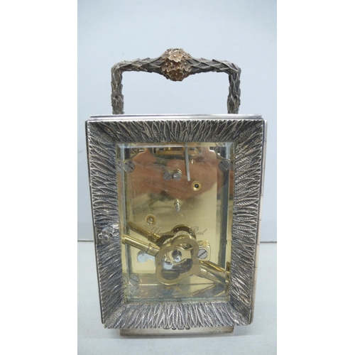 57 - Stuart Devlin heavy silver carriage clock with flower and leaf decration to handle, leaf decoration ... 