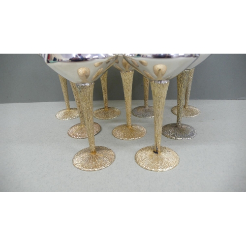 68 - A set of nine Stuart Devlin Parcel Gilt Silver red wine goblets with inverted conical bowls, reeded ... 