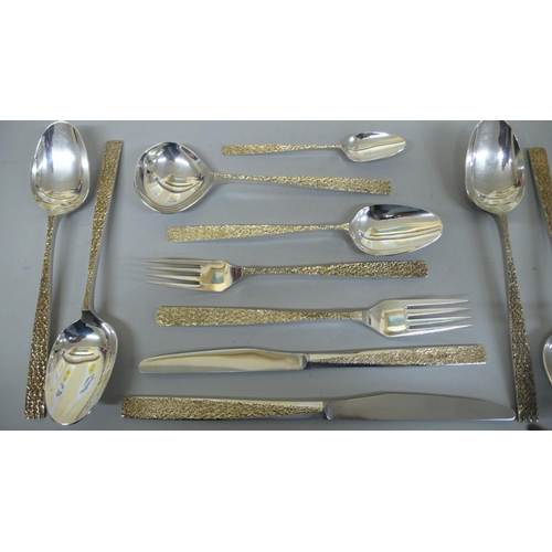 77 - Stuart Devlin Parcel Gilt silver hand forged set of cutlery for eight persons with bark finish to ha... 