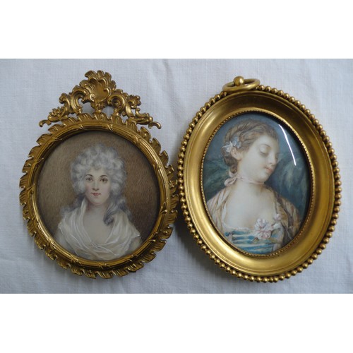 149 - Two French miniatures of beauties in brass frames - oval - ht. 3.5 ins