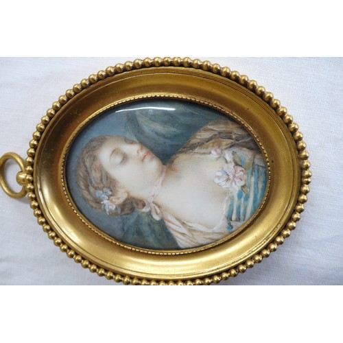 149 - Two French miniatures of beauties in brass frames - oval - ht. 3.5 ins