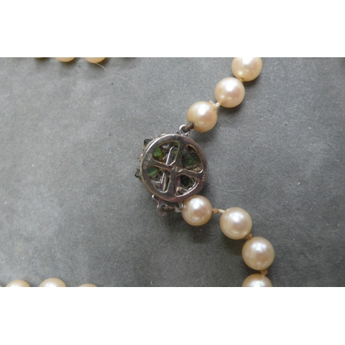 374 - Boodle and Dunthorpe graduated cultured Pearl necklace with an 18 ct. white gold peridot and diamond... 