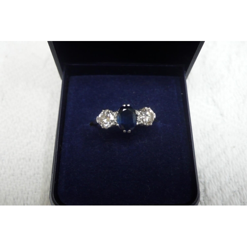 378 - Platinum sapphire and diamond three stone ring - size M/N