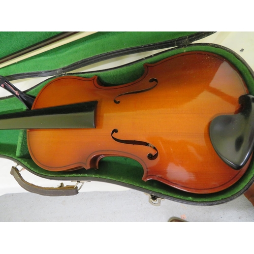 70 - Two cased modern student violins