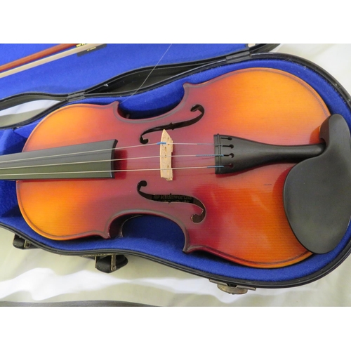 70 - Two cased modern student violins