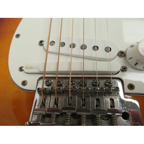 107 - Fender made in Mexico Stratocaster - sunburst body, three single coil pickups plus Roland at the bri... 