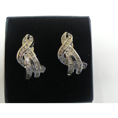 383 - Pair of Brilliant and baguette cut diamond earrings set in 18ct white gold, colour VSI S12 clarity