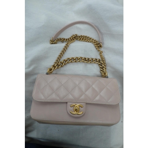 198 - Chanel straight line flap bag, quilted pale pink leather with gold plated long and short handles, go... 