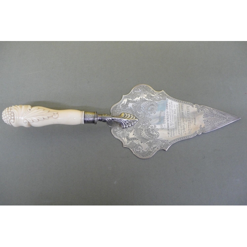 8 - An ornate silver and carved bone handled bricklayers trowel, presented to Alexander Gill Esq. by the... 