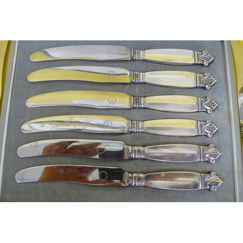 14 - Georg Jensen, A boxed set of six silver handled Sheffield steel bladed butter knives plus two loose