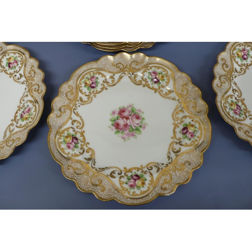 43 - A pretty sixteen piece crescent china fluted dessert service with painted gilt borders and decoratio... 