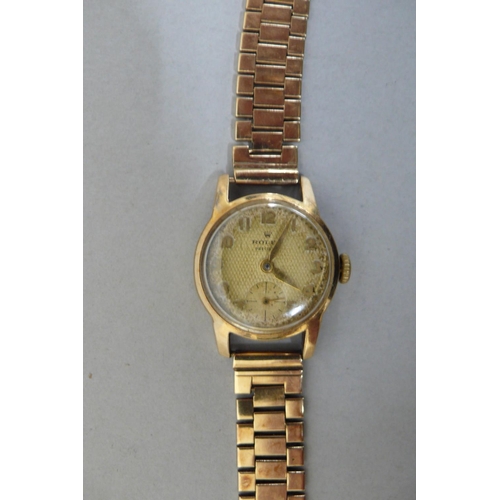 107 - Ladies 9ct Gold Rolex Precision wind up wristwatch with gold strap, Boxed, Total weight 24.5 grms