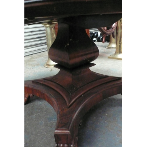 121 - A Regency Rosewood circular flip top loo table with square baluster column, quatre foile pedestal ba... 