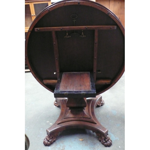 121 - A Regency Rosewood circular flip top loo table with square baluster column, quatre foile pedestal ba... 