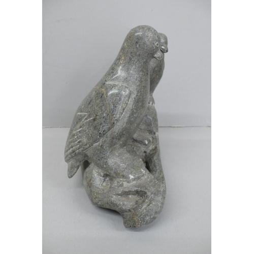 138 - Innuit soap stone sculpture of two penguins standing on a rock.
Signed to base BH, No. 4-29920, Ht. ... 