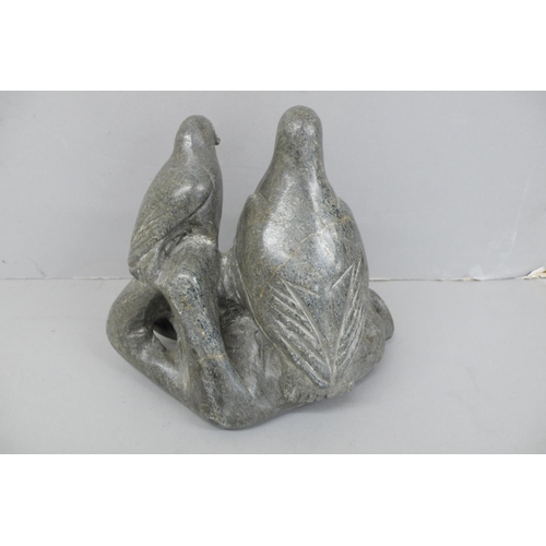 138 - Innuit soap stone sculpture of two penguins standing on a rock.
Signed to base BH, No. 4-29920, Ht. ... 