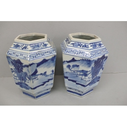 144 - Pair of 19th/20thC Chinese blue and white hexagonal vases with decoration of figure crossing a bridg... 