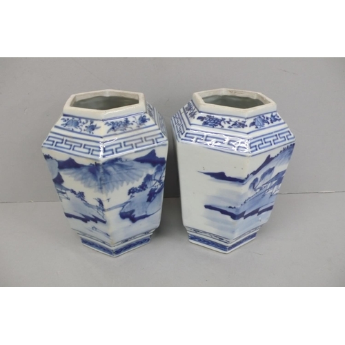 144 - Pair of 19th/20thC Chinese blue and white hexagonal vases with decoration of figure crossing a bridg... 