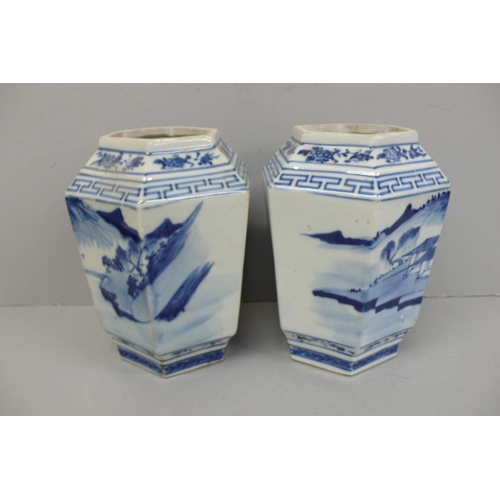 144 - Pair of 19th/20thC Chinese blue and white hexagonal vases with decoration of figure crossing a bridg... 