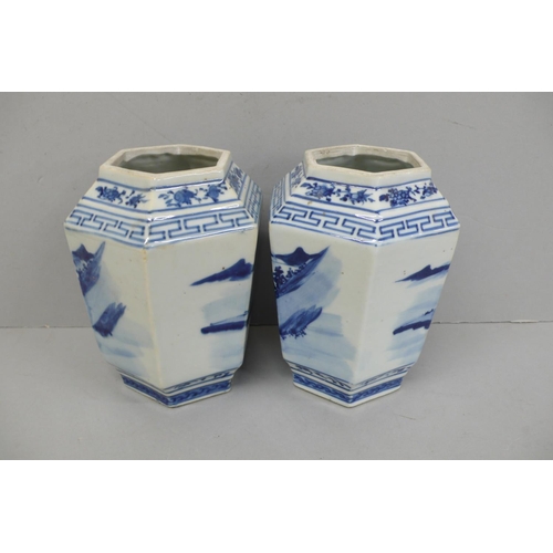 144 - Pair of 19th/20thC Chinese blue and white hexagonal vases with decoration of figure crossing a bridg... 