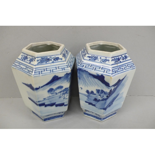144 - Pair of 19th/20thC Chinese blue and white hexagonal vases with decoration of figure crossing a bridg... 