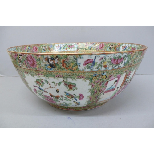 146 - A 19thC Canton Porcelain punch bowl with decoration of cartouches of figures, birds and insects, Dia... 