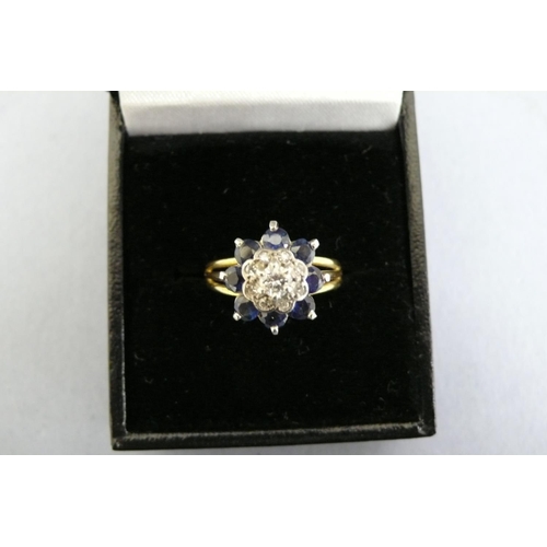 175 - An 18ct Gold Sapphire and Diamond Cluster ring (Tested), Size N