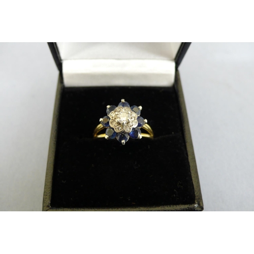 175 - An 18ct Gold Sapphire and Diamond Cluster ring (Tested), Size N